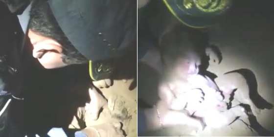 Momento em que a menina recém-nascida é desenterrada pelos policiais.