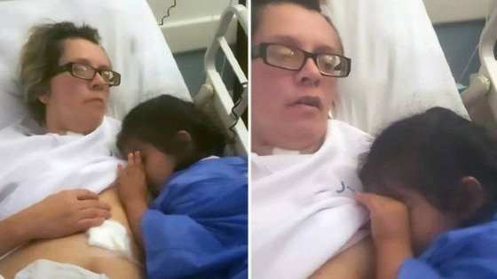 Automaticamente, Maria Laura abriu os olhos, levantou a bata e começou a amamentar a menina.