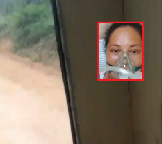 No vídeo, a mulher aparece sozinha dentro da parte de trás do veículo tomando medicação