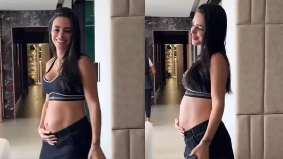 Nas imagens, a gestante anda pela casa e faz carinho na barriga