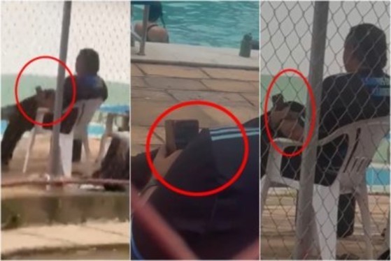 Nas imagens, ele aparece sentado próximo à piscina, com o aparelho apontado em direção aos jovens