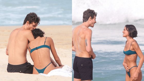 Bruna Marquezine e Shawn Mendes se divertem na areia da praia, trocando sorrisos e abraços.