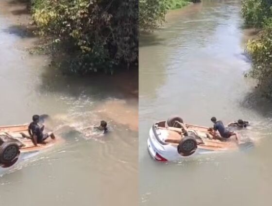 Populares quebraram o vidro do automóvel submerso para resgatar a criança.