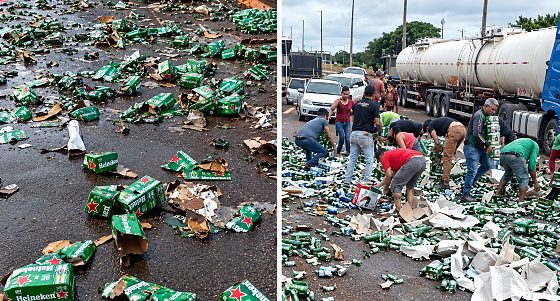Caminhão tomba e populares saqueiam carga de cerveja